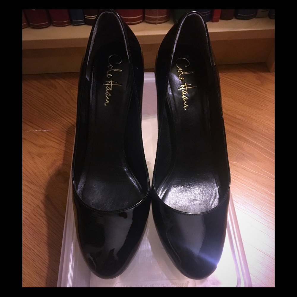 Cole Haan Round Patent Pumps.